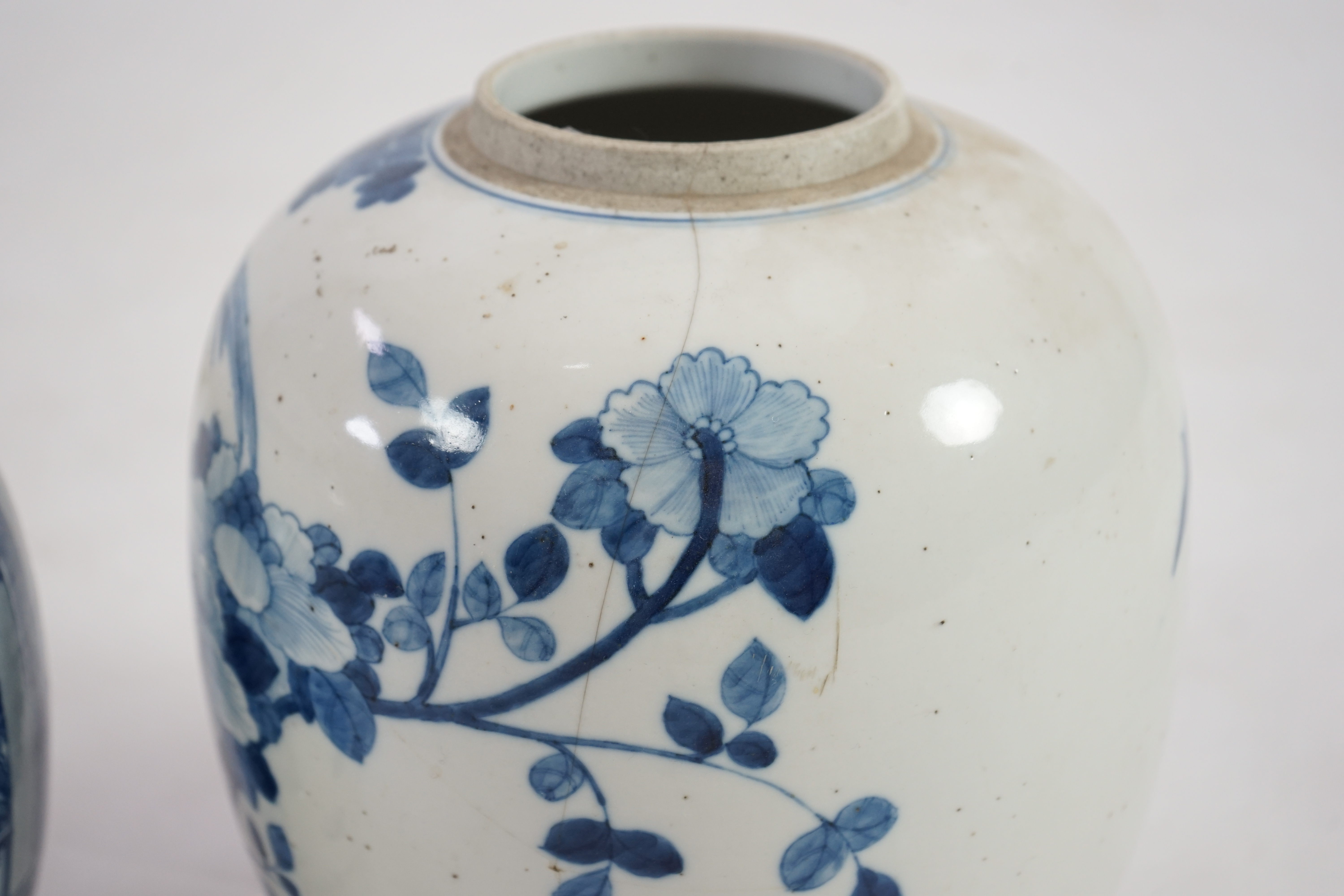 Two Chinese blue and white ovoid jars, one with associated cover, 19th century